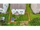 Aerial view of a backyard featuring a fenced yard, green grass, storage shed and small deck at 5280 Lakerock Way, South Fulton, GA 30331