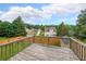 Wooden deck overlooking a spacious backyard with shed and wooden fence at 5280 Lakerock Way, South Fulton, GA 30331
