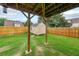 Backyard featuring a wooden fence, a lawn, and a shed at 5280 Lakerock Way, South Fulton, GA 30331