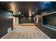 Finished basement featuring plush carpeting, unique wall lighting, and a raised platform at 5280 Lakerock Way, South Fulton, GA 30331