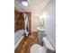 Bathroom featuring a tub, shower, tile flooring, vanity and toilet at 5280 Lakerock Way, South Fulton, GA 30331