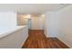 Bright and spacious hallway with hardwood floors and white walls at 5280 Lakerock Way, South Fulton, GA 30331