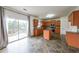 Well-equipped kitchen with island, stainless steel appliances, and access to the outdoor deck at 5280 Lakerock Way, South Fulton, GA 30331