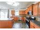 Modern kitchen with stainless steel appliances and a breakfast bar area at 5280 Lakerock Way, South Fulton, GA 30331