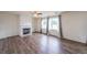 Spacious living room featuring a fireplace and beautiful hardwood floors at 5280 Lakerock Way, South Fulton, GA 30331