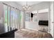Bright dining area with sliding glass doors leading to the outside and views into the living room at 6279 Marbut Farms Rd, Lithonia, GA 30058
