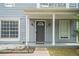 Inviting front entry with a classic door, decorative columns, and well-manicured landscaping at 6279 Marbut Farms Rd, Lithonia, GA 30058
