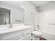 Bathroom with white vanity, toilet, and shower-tub combo at 1800 Clairmont Lk # 412, Decatur, GA 30033