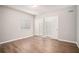 Bedroom with wood-look floors, closet and window with blinds at 1800 Clairmont Lk # 412, Decatur, GA 30033