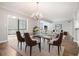 Elegant dining room features modern furniture, chandelier, and lots of light at 1800 Clairmont Lk # 412, Decatur, GA 30033