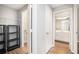 Hallway featuring a closet and a view of a bathroom with a white vanity at 1800 Clairmont Lk # 412, Decatur, GA 30033