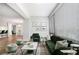 Modern living room featuring plush furniture and green accents with open-concept floor plan at 1800 Clairmont Lk # 412, Decatur, GA 30033