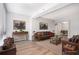 Spacious living room features modern decor, wood floors, and lots of natural light at 1800 Clairmont Lk # 412, Decatur, GA 30033