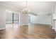 Spacious living room with hardwood floors, lots of natural light, and an elegant chandelier at 1800 Clairmont Lk # 412, Decatur, GA 30033