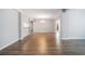 Spacious living area with wood-look floors, modern chandelier, and neutral color scheme at 1800 Clairmont Lk # 412, Decatur, GA 30033