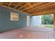 Cozy covered porch with wooden deck, providing a relaxing outdoor space with backyard views at 2067 Kinridge Ct, Marietta, GA 30062