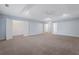 Expansive bedroom featuring neutral carpet, tray ceiling with fan, and two walk-in closets at 2067 Kinridge Ct, Marietta, GA 30062