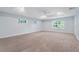 Large bedroom with tray ceiling, recessed lighting, and multiple windows providing ample natural light at 2067 Kinridge Ct, Marietta, GA 30062