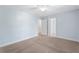 Spacious carpeted bedroom with a ceiling fan and view into the ensuite at 2067 Kinridge Ct, Marietta, GA 30062