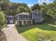 Inviting home with a well-maintained lawn, mature trees, and a detached garage at 2067 Kinridge Ct, Marietta, GA 30062