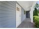 Charming front porch featuring classic columns and a stylish wood plank floor at 2067 Kinridge Ct, Marietta, GA 30062