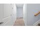 Hallway with carpet and multiple white doors at 2067 Kinridge Ct, Marietta, GA 30062