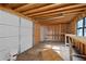 Interior of the storage building featuring a roll-up door and exposed framing at 2067 Kinridge Ct, Marietta, GA 30062