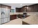 Modern kitchen featuring stainless steel appliances, granite countertops, and wood cabinets at 2067 Kinridge Ct, Marietta, GA 30062