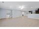 Spacious open-concept living room features tile flooring, recessed lighting and neutral paint at 2067 Kinridge Ct, Marietta, GA 30062