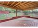 Covered patio area with wood floors and open view of the backyard at 2067 Kinridge Ct, Marietta, GA 30062