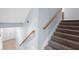 Carpeted staircase with wood handrail at 2067 Kinridge Ct, Marietta, GA 30062