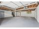 Spacious unfinished basement with concrete floor and exposed ceiling, offering possibilities for customization at 4760 Silverdale Rd, College Park, GA 30349