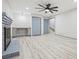 Finished basement features a brick fireplace, a desk with storage, and light gray flooring at 4760 Silverdale Rd, College Park, GA 30349