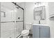 Modern bathroom with glass shower, marble tile, and contemporary vanity at 4760 Silverdale Rd, College Park, GA 30349