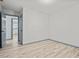 This empty bedroom features wood-look floors and neutral paint at 4760 Silverdale Rd, College Park, GA 30349