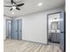 Bedroom with wood-look floors leading to bathroom with gray vanity at 4760 Silverdale Rd, College Park, GA 30349