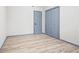 This bedroom features wood-look floors and a closet at 4760 Silverdale Rd, College Park, GA 30349