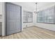 Dining room featuring a chandelier, closet, and large windows at 4760 Silverdale Rd, College Park, GA 30349