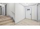 Inviting foyer with light wood-look flooring and modern, freshly painted trim at 4760 Silverdale Rd, College Park, GA 30349