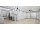 Open concept living space featuring updated kitchen appliances and light gray wood floors at 4760 Silverdale Rd, College Park, GA 30349