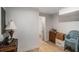 Basement area showcasing wood-look flooring and access to additional rooms at 992 Brian Ln, Forest Park, GA 30297