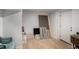 Unfinished basement area featuring wood-look flooring and a white door at 992 Brian Ln, Forest Park, GA 30297
