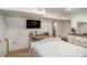Finished basement bedroom with painted cinder block and mounted television at 992 Brian Ln, Forest Park, GA 30297