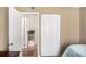 Bedroom with wood floors with view to hall, second door and closet at 992 Brian Ln, Forest Park, GA 30297