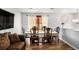 A dining table with an elegant tablecloth is surrounded by chairs and decorative touches at 992 Brian Ln, Forest Park, GA 30297