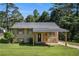 Charming home with a covered carport and a well-maintained lawn at 992 Brian Ln, Forest Park, GA 30297