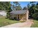 Charming home with a covered carport and a spacious concrete driveway at 992 Brian Ln, Forest Park, GA 30297