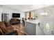 Inviting living room with wood floors, a large TV, and comfortable seating at 992 Brian Ln, Forest Park, GA 30297