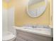A bathroom with a marble countertop, white fixtures, and a shower at 22 Cardinal Ln, Jonesboro, GA 30238