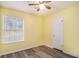 Cozy bedroom features wood-look flooring and a light-filled window at 22 Cardinal Ln, Jonesboro, GA 30238
